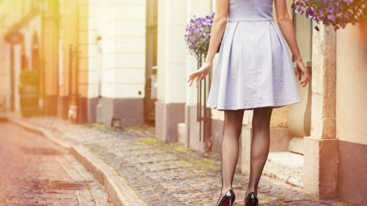 Retro Woman's Legs Short Skirt Black Heels Cobblestone Streets