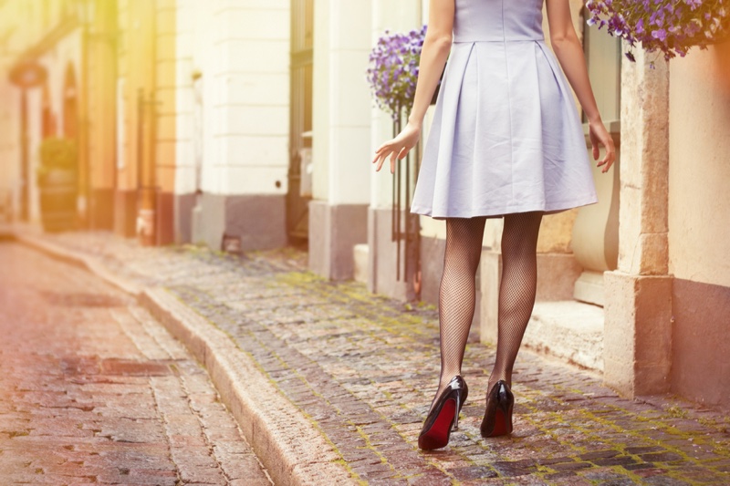 Retro Woman's Legs Short Skirt Black Heels Cobblestone Streets