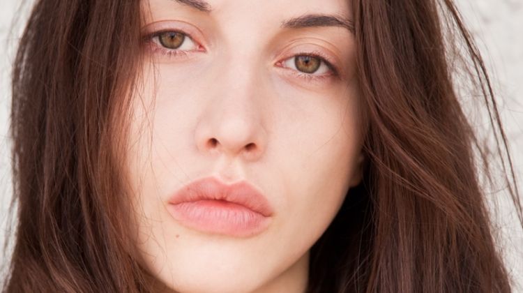 What Are the Common Causes of Dark Circles and Eye Bags (And How to Defy Them)? Tired Looking Brunette Woman Portrait