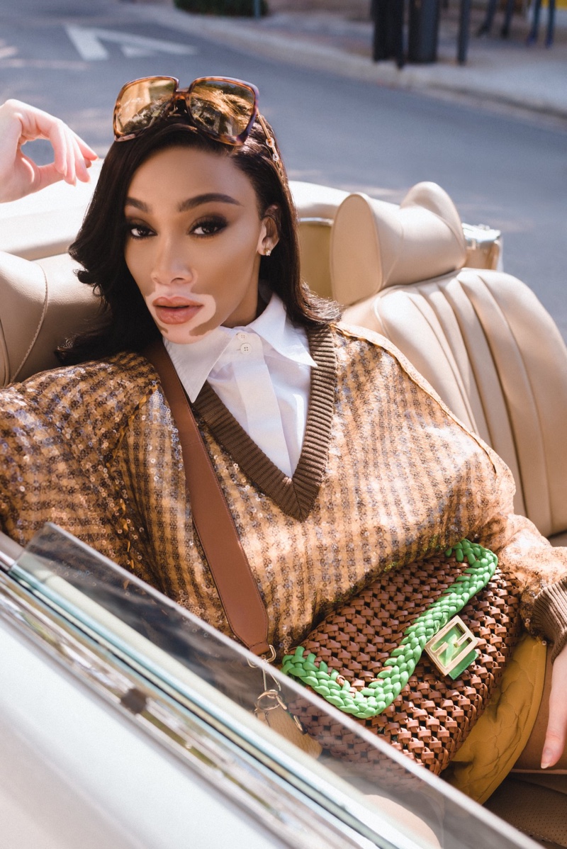 Winnie Harlow poses in a convertible for Fendi #BaguetteFriendsForever campaign