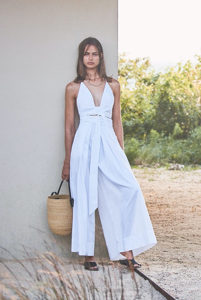 Dressed in white, Birgit Koss poses for Alexis spring-summer 2020 campaign