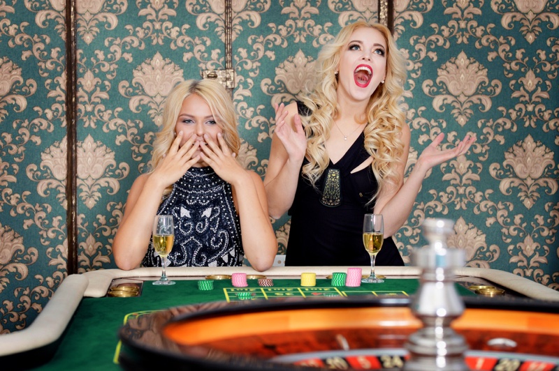 Blonde Girls Roulette Table Celebrating
