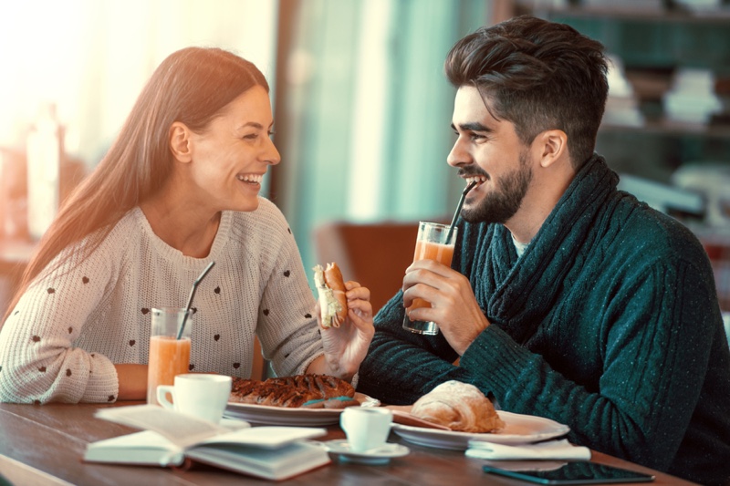 Couple Cafe Sandwiches Smiling Drinking