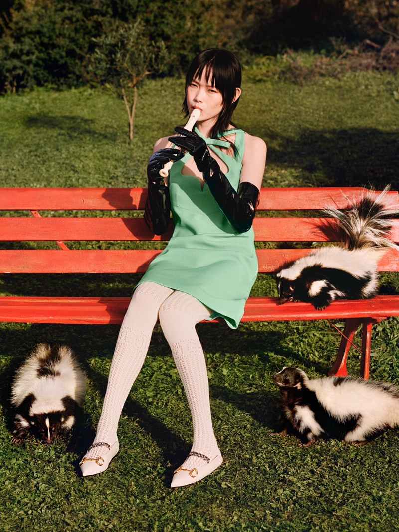 A model poses with skunks in Gucci's pre-fall 2020 campaign.