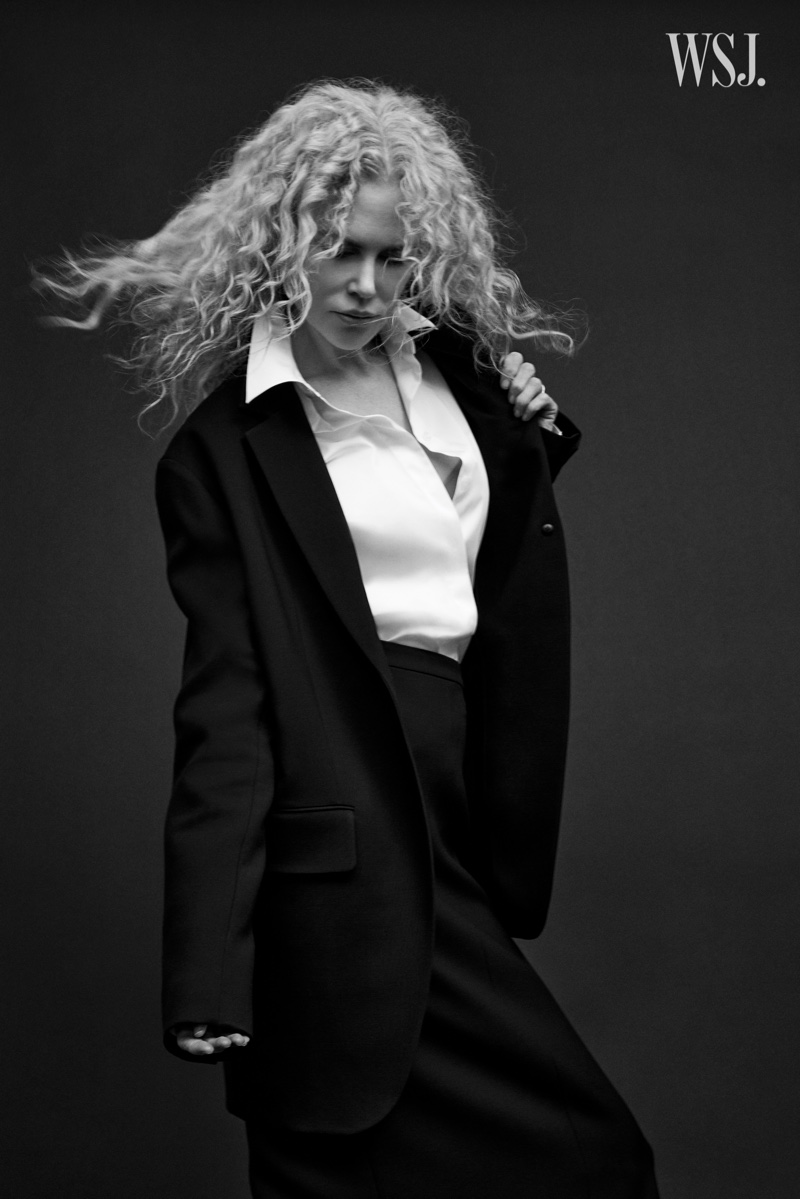 Suiting up, Nicole Kidman poses in black and white image.