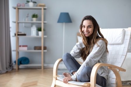 10 Tips to Turn Your Home Into a Stress Reducing Zone Smiling Woman Casual Home Chair
