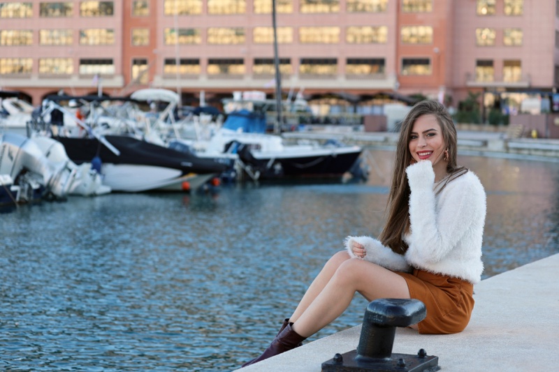 Woman Monte Carlo White Sweater Brown Skirt Water