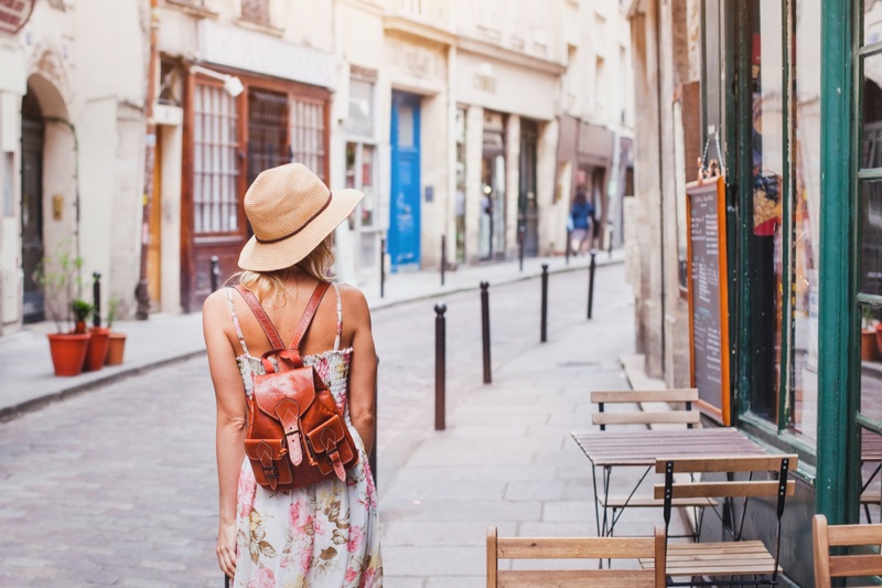 Woman Traveling Back Floral Print Dress Straw Hat Backpack