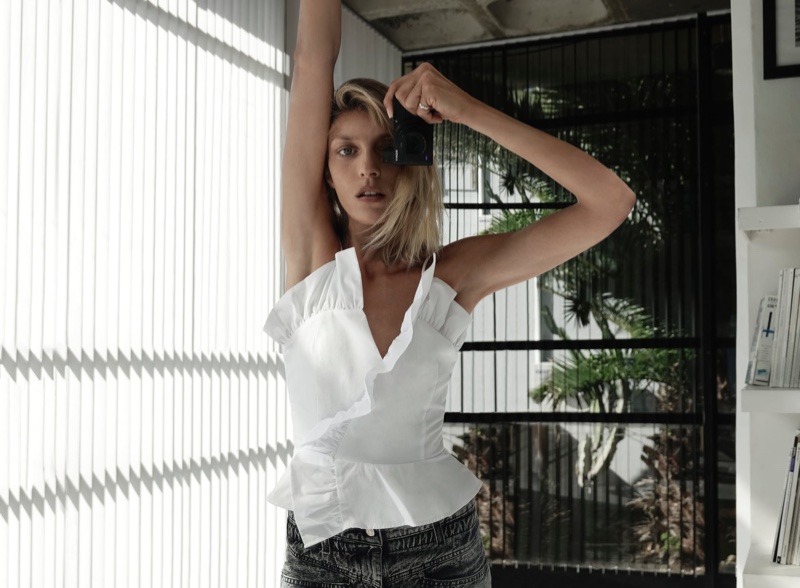 Anja Rubik snaps a photo in Zara at home fashion shoot.