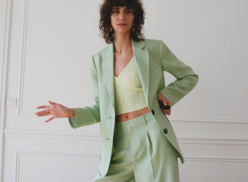 Model Mica Arganaraz suits up in green Zara ensemble.
