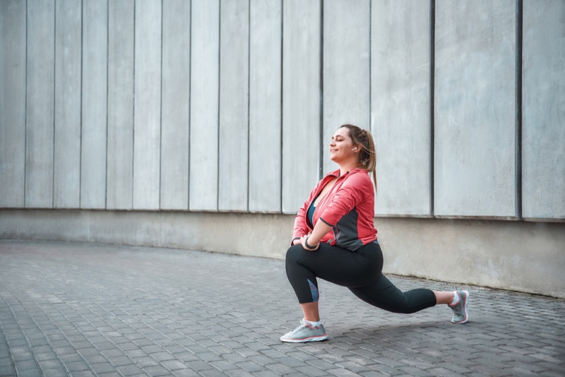 Plus Size Model Happy Stretching Workout