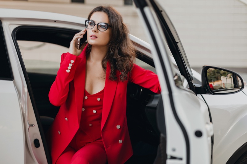 Woman Red Pantsuit White Car Phone Cat Eye Glasses