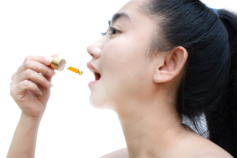 Asian Woman Oil Dropper