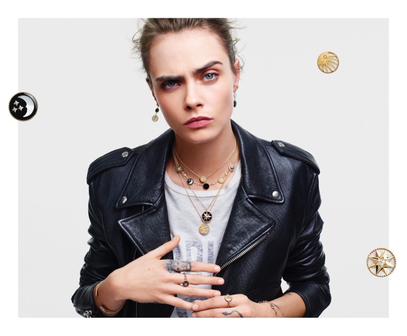 Wearing a leather jacket, Cara Delevingne fronts Dior Lucky Charms 2020 jewelry campaign.