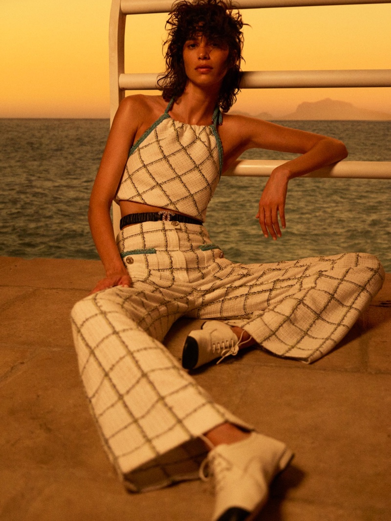 Mica Arganaraz wears checkered print in Chanel Cruise 2021 collection.