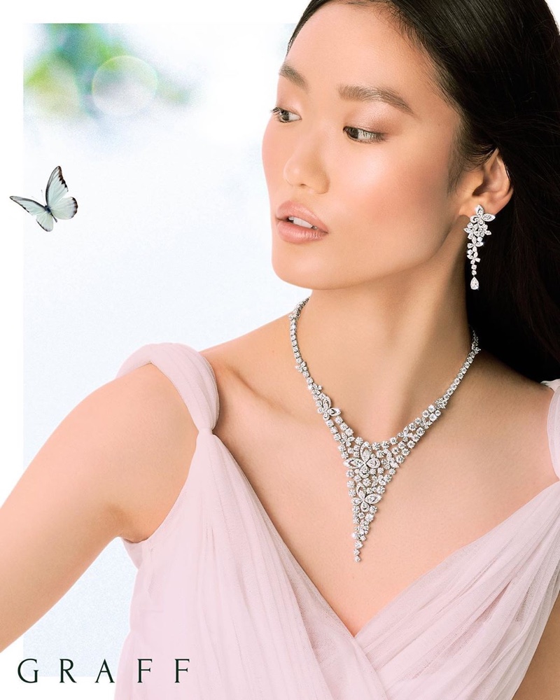 Wearing butterfly accents, Xiaoni Wang poses for Graff Diamonds.