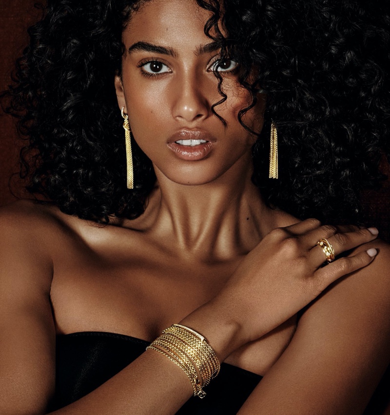 Imaan Hammam shines in gold David Yurman jewelry for Holt Renfrew.