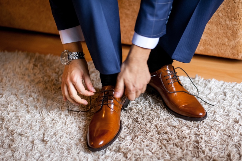 Man Tying Shoes Socks Watch Dapper