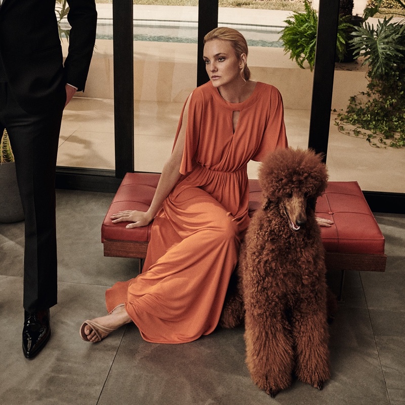 Caroline Trentini poses alongside a fluffy dog in Max Mara dress.