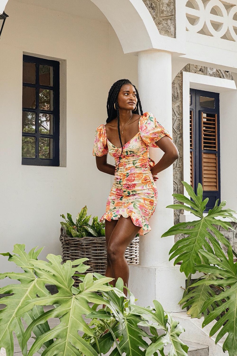 Model Melodie Monrose poses in For Love & Lemons Versilla mini dress.