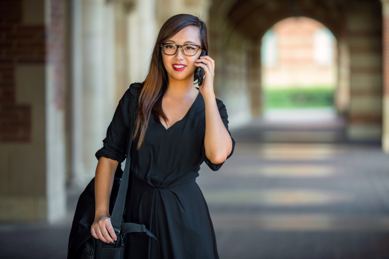 Professional Looking Woman Black Dress Phone Glasses