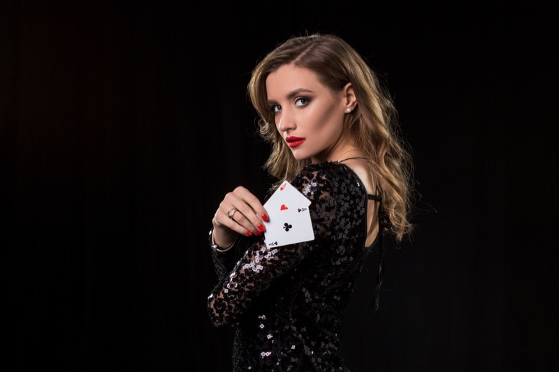Woman Holding Cards Black Sequin Dress