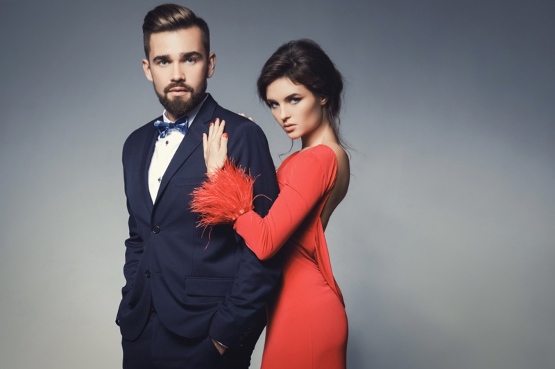 Couple Man Suit Woman Red Dress Feathers