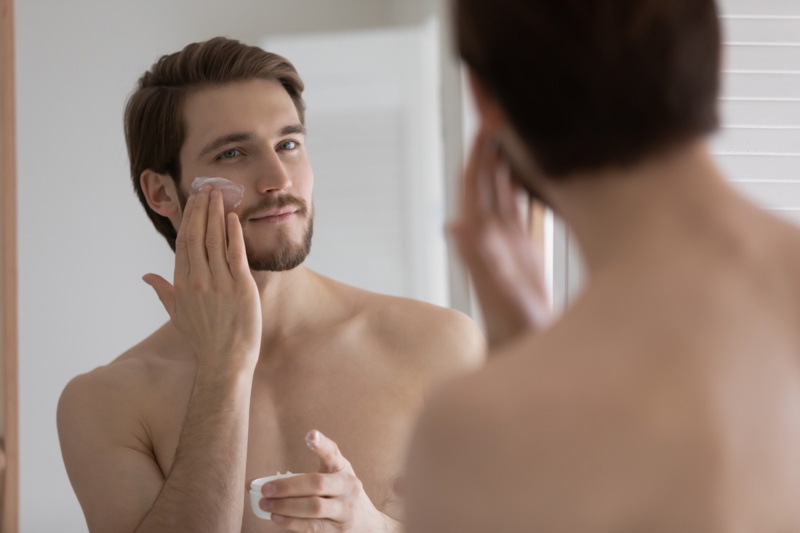 Man Applying Moisturizer Face Cream