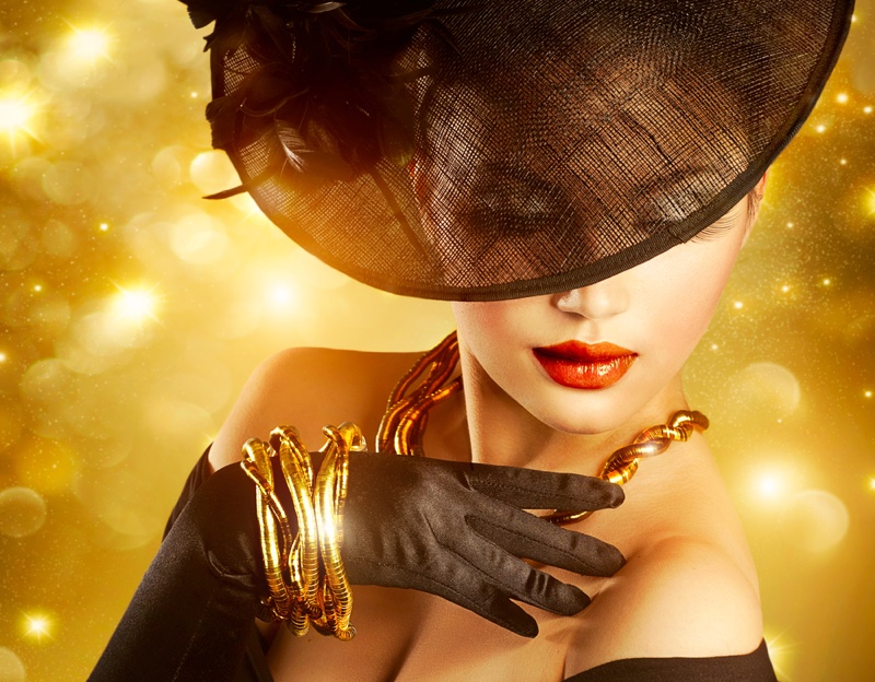 Model Wearing Gold Jewelry Wide Hat Gloves Glamour