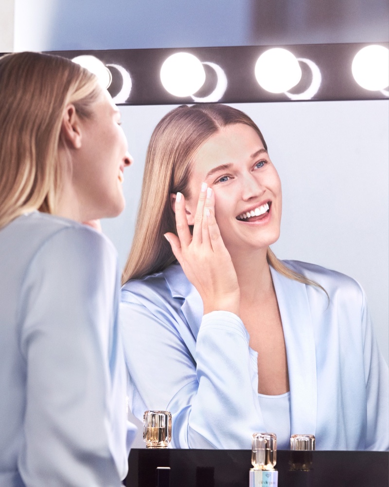 Toni Garrn flashes a smile in Clé de Peau Beauté Le Serum shoot.