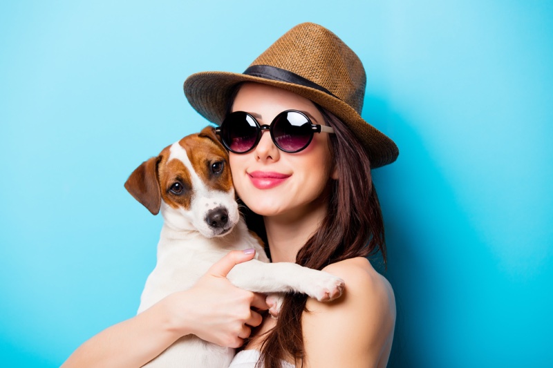 Woman Holding Dog Smiling Sunglasses Hat