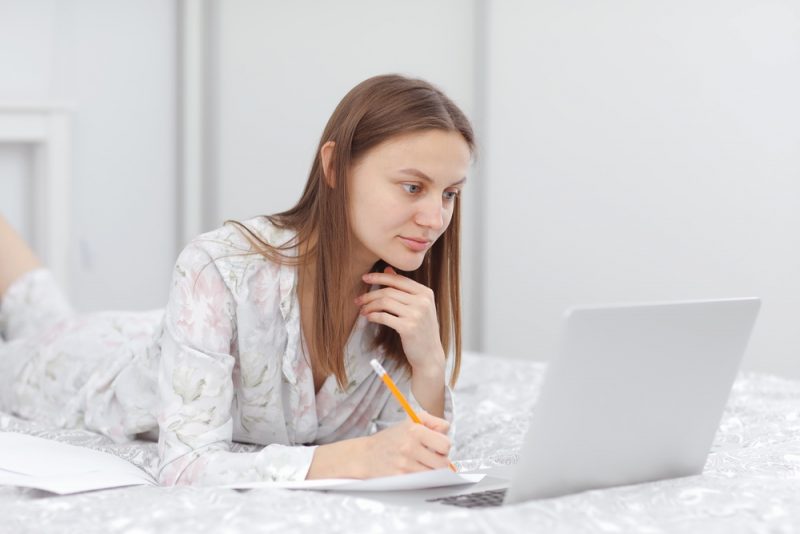 Woman Researching on Laptop