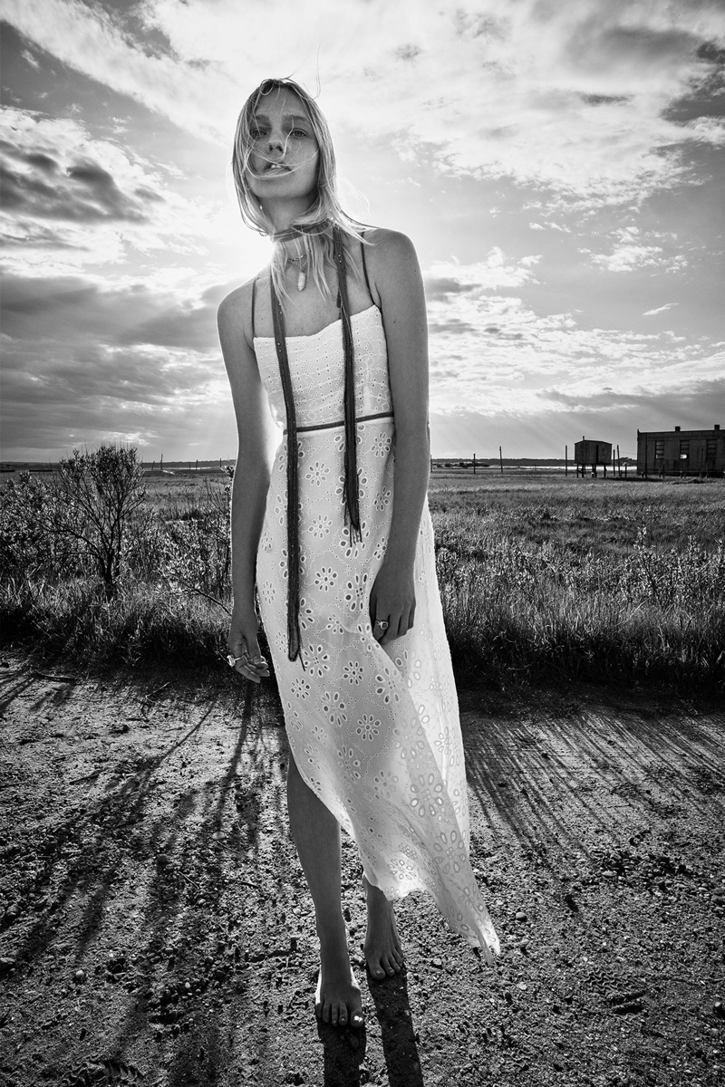 Model Sasha Pivovarova poses in Zara eyelet lace dress.