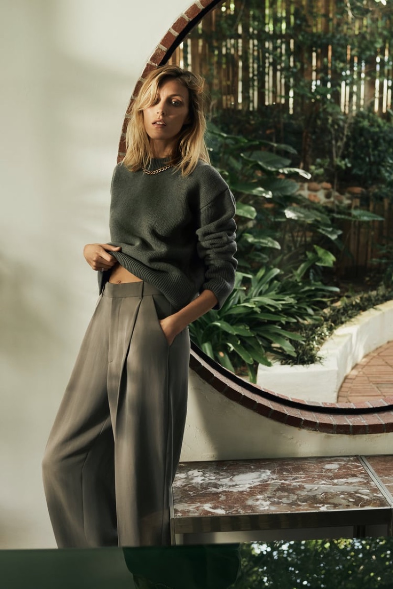 Anja Rubik poses in Zara wool sweater and trousers.