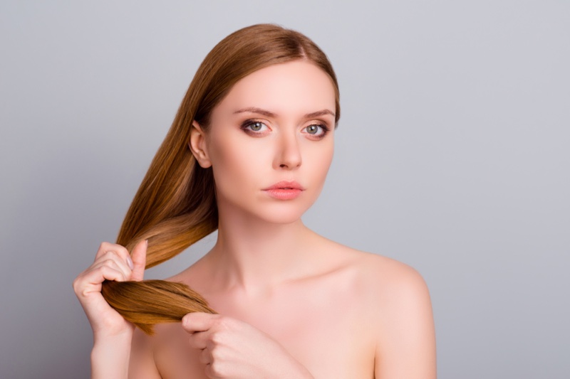 Beauty Model Holding Hair