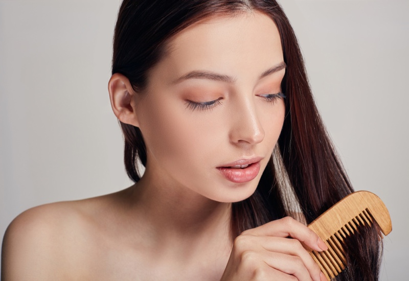 Brunette Woman Combing Hair Beauty