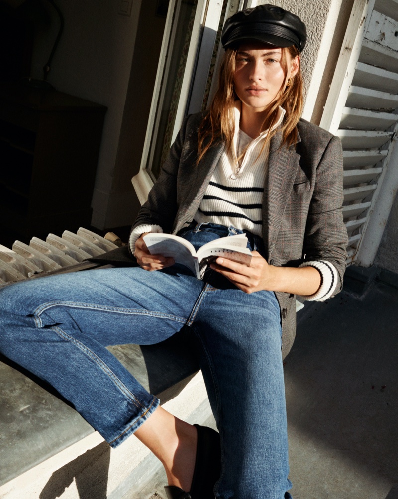 With a book in hand, Grace Elizabeth tries on Mango's fall 2020 collection.