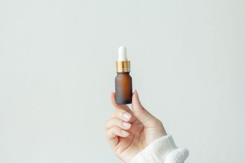 Hand Woman Holding Oil Bottle Cosmetics