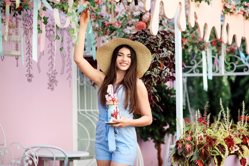 Smiling Woman Blue Romper Cafe Outdoors