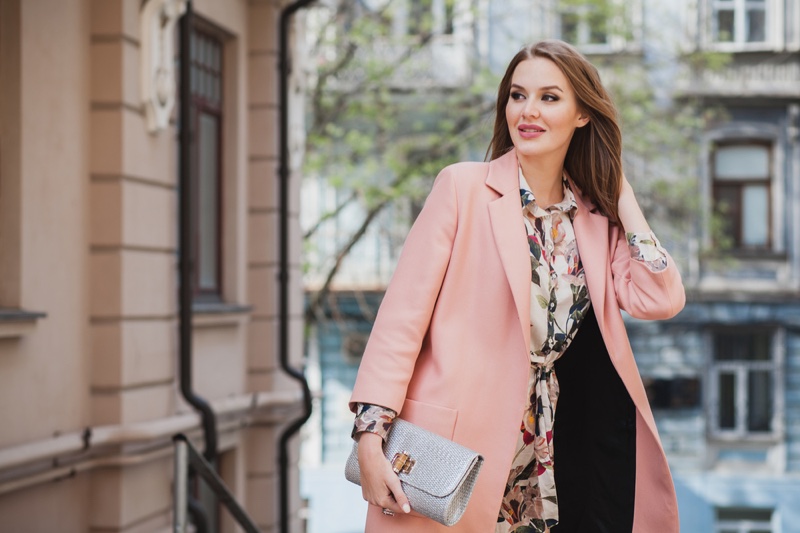 Stylish Woman Pink Blazer Floral Print Holding Bag