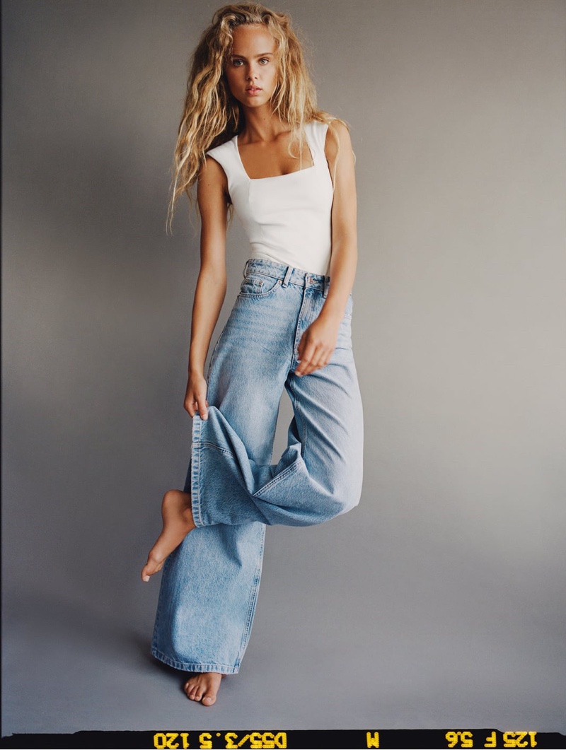 Olivia Vinten wears hi-rise jean cuts from Zara.