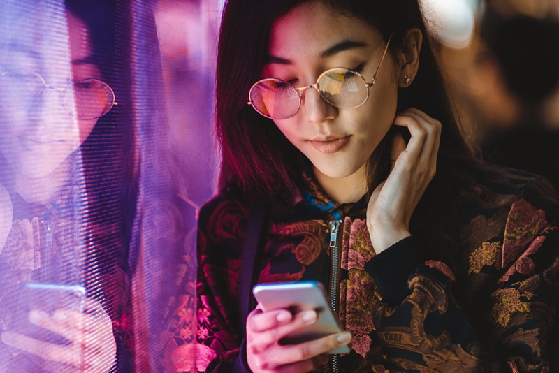 Asian Woman Glasses Phone Brocade Jacket