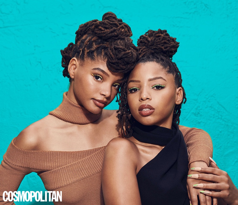 Sisters Chloe x Halle pose in Monse dresses.