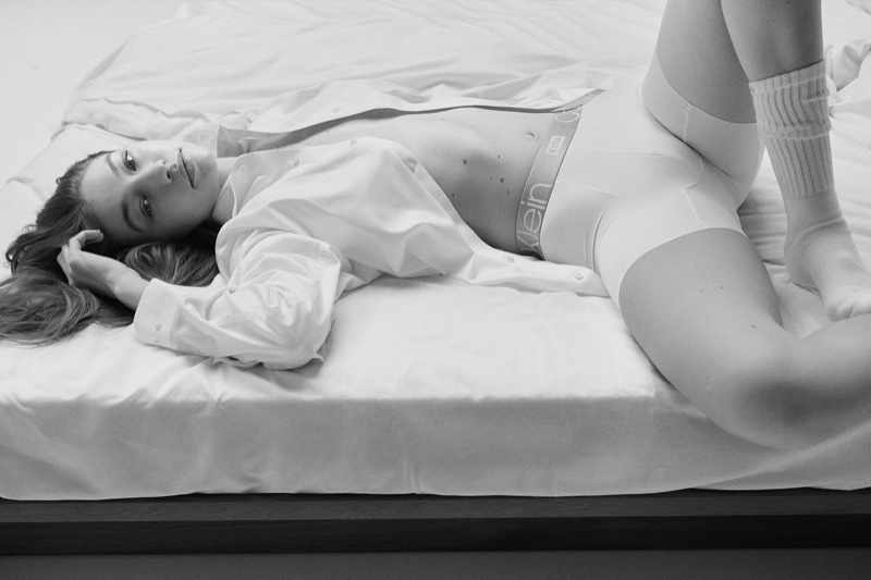 Lounging in bed, Gigi Hadid fronts Calvin Klein x Kith campaign.