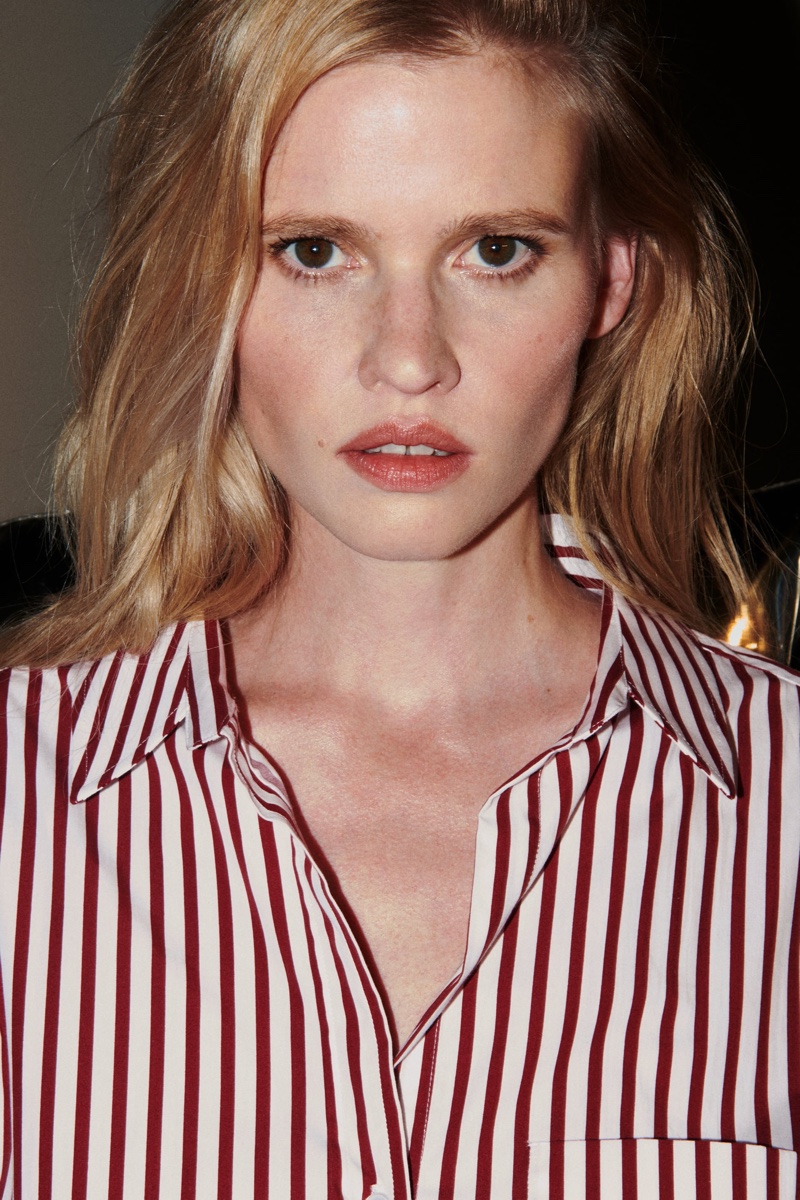 Model Lara Stone wears Zara striped poplin shirt.