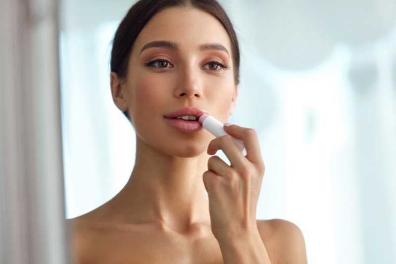 Model Applying Lip Balm Makeup Beauty
