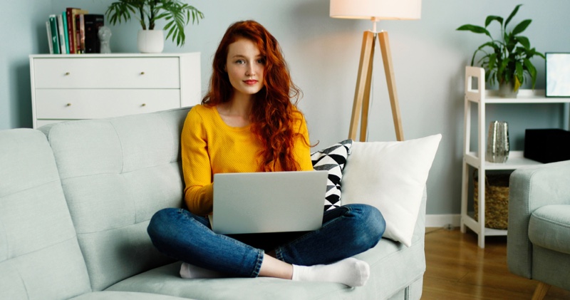 Redhead Woman Living Room Couch Laptop