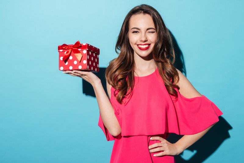 Smiling Woman Polka Dot Print Gift Box Pink Dress