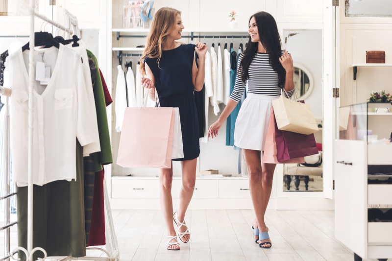 Two Women Friends Shopping Clothing Store Bags