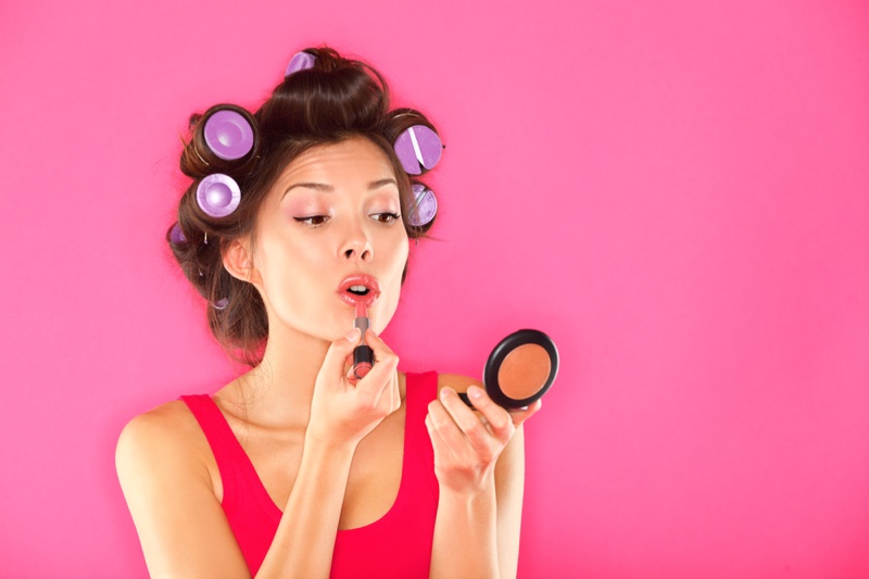 Woman Applying Makeup Rollers Hair Compact